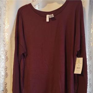 Medium8/10, polyester/ spandex long sleeve blouse.